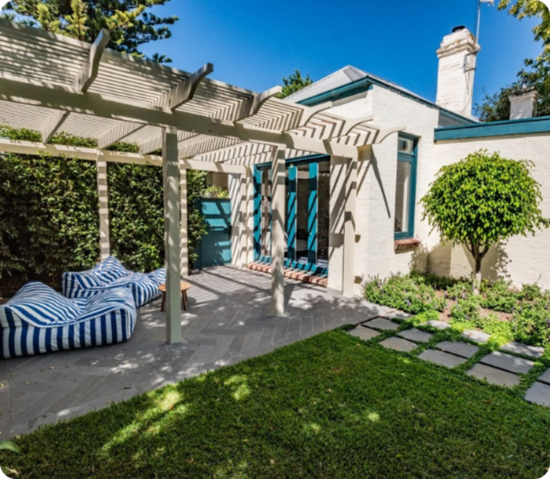 Generous family lawn with layered planting in Sandringham backyard
